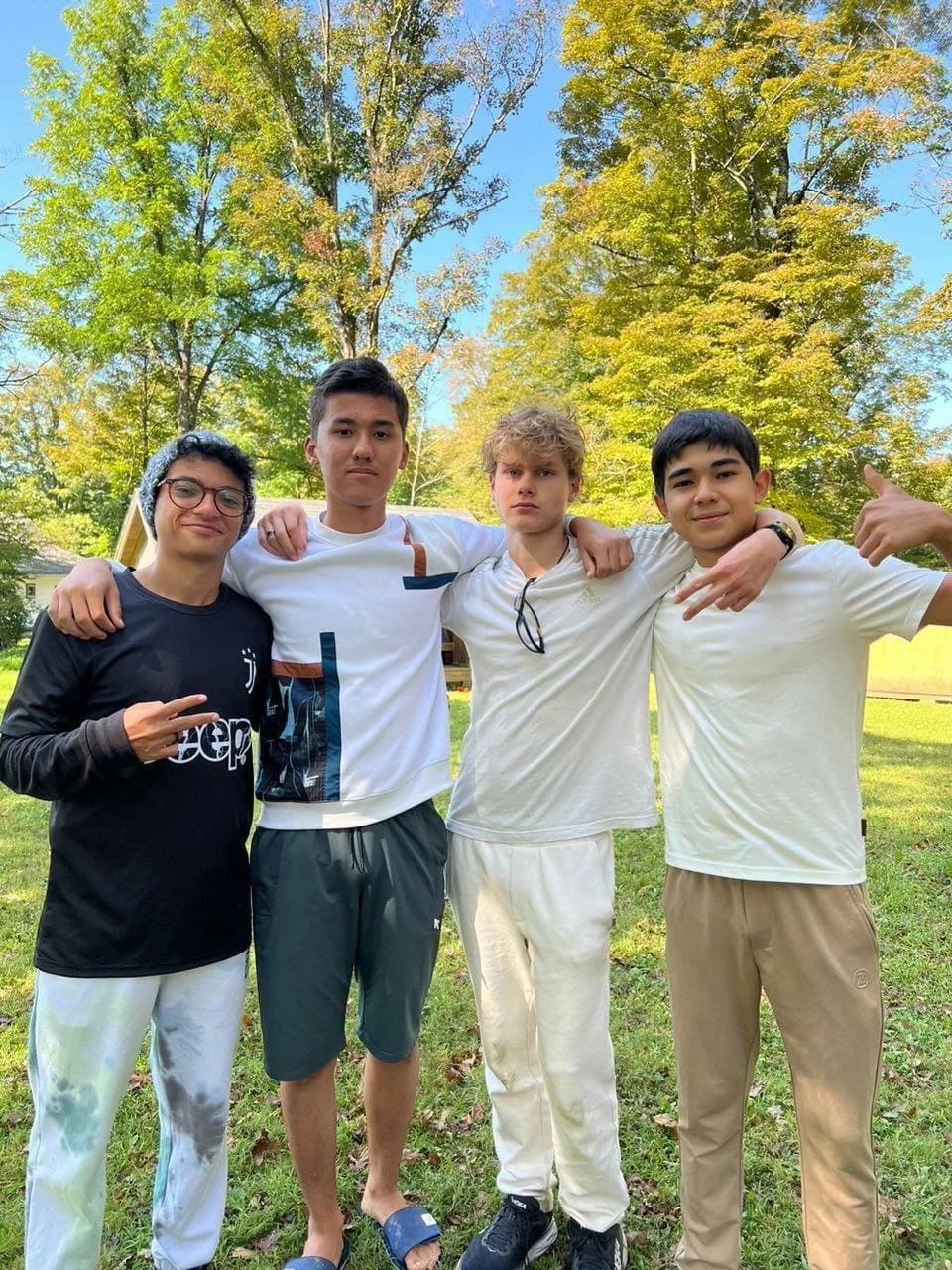 Four friends from camp, arm in arm