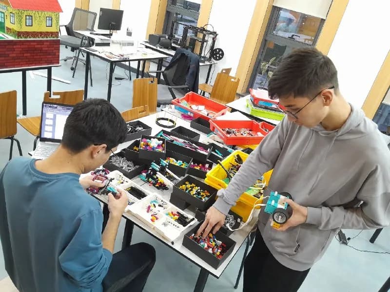 Working on robotics electronics with teammates